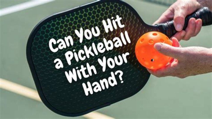 Can you hit the ball with your hand in pickleball?