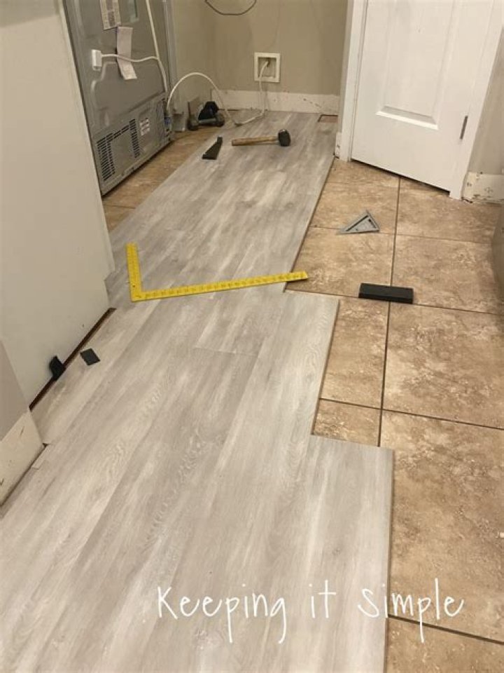 Can you put wood laminate over tile?