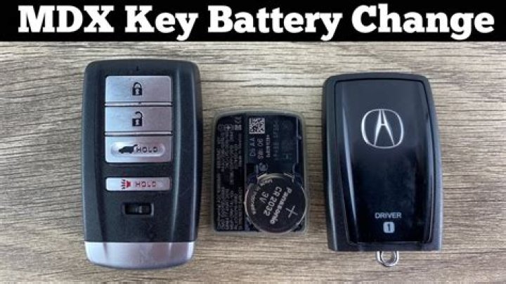 How do I change the battery in my 2014 Acura MDX key fob?