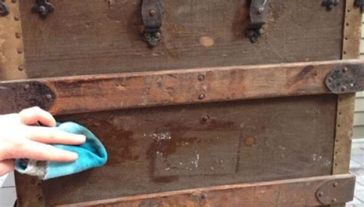 How do I clean the metal on my antique trunk?