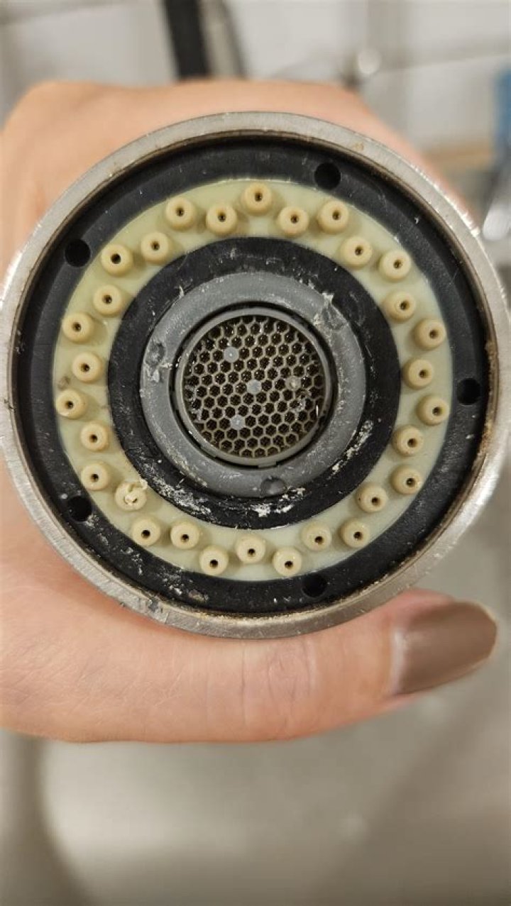 How do I remove the aerator from my Pfister faucet?