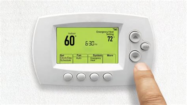 How do I set the emergency heat on my vivint thermostat?