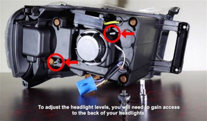 How do you adjust the headlights on a 2003 Nissan Altima?