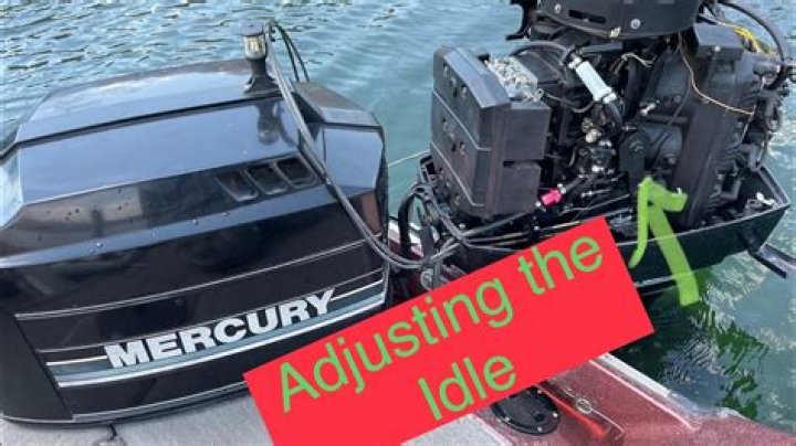 How do you adjust the idle on a Mercury outboard motor?