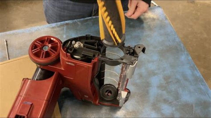 How do you change the belt on a shark rotator?