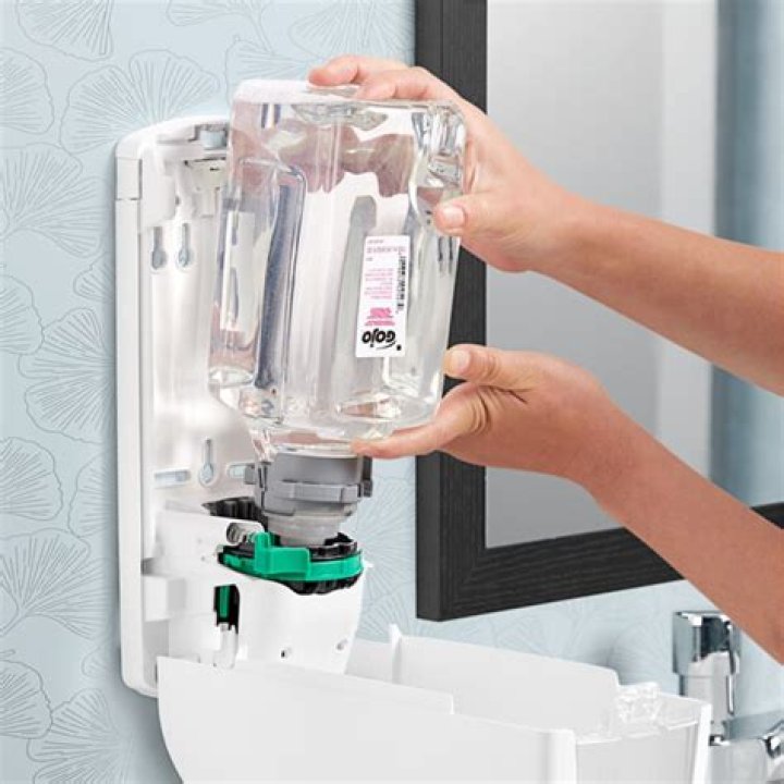 How do you change the soap in a Gojo dispenser?