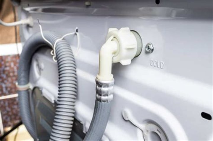 How do you clamp a washing machine drain hose?