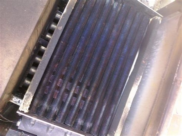 How do you clean a Hayward heat exchanger?