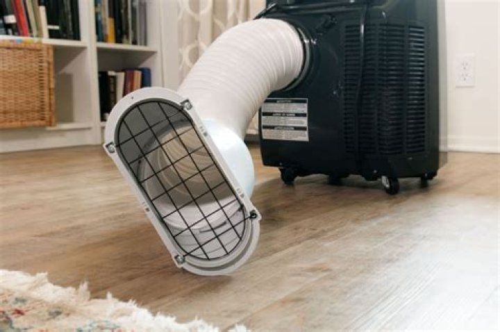 How do you clean a portable air conditioner coil?