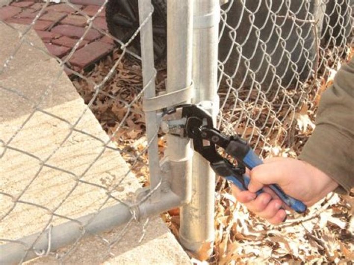 How do you fix a misaligned chain link fence gate?