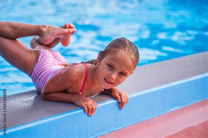 How do you get rid of an oily film in a swimming pool?