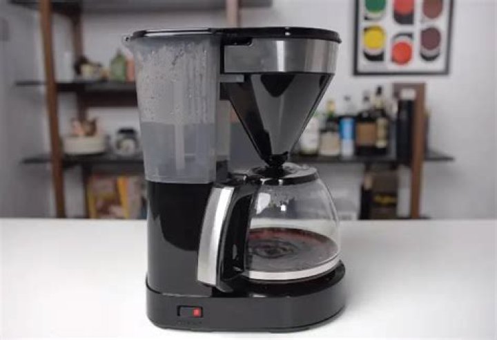 How do you get the plastic taste out of a new coffee maker?