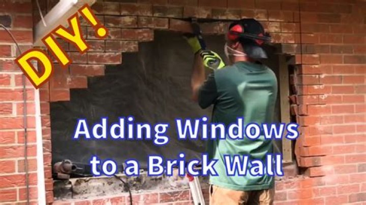 How do you install a window in a brick wall?