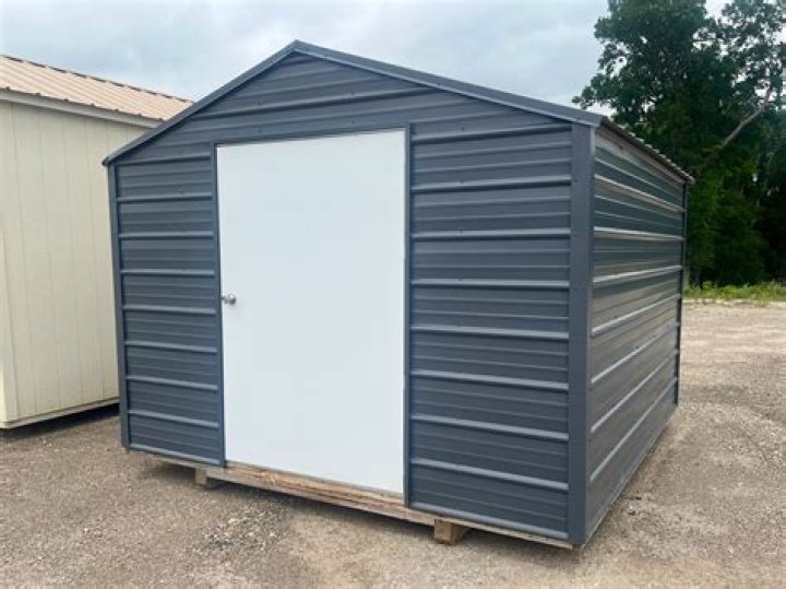 How do you install corrugated metal siding on a shed?