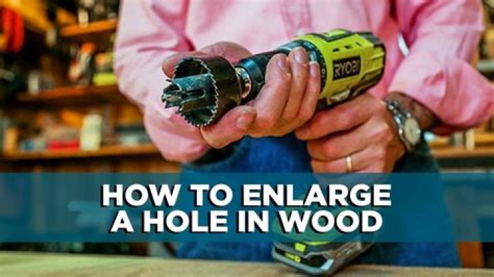 How do you make an existing hole in wood bigger?