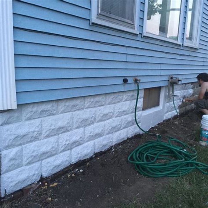 How do you paint a brick foundation?