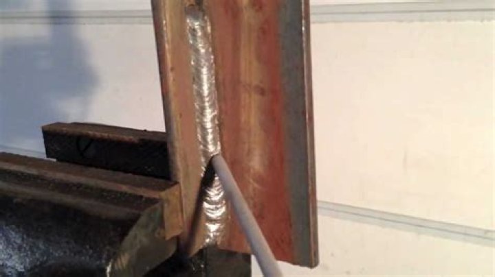 How do you stick weld vertical 7018?