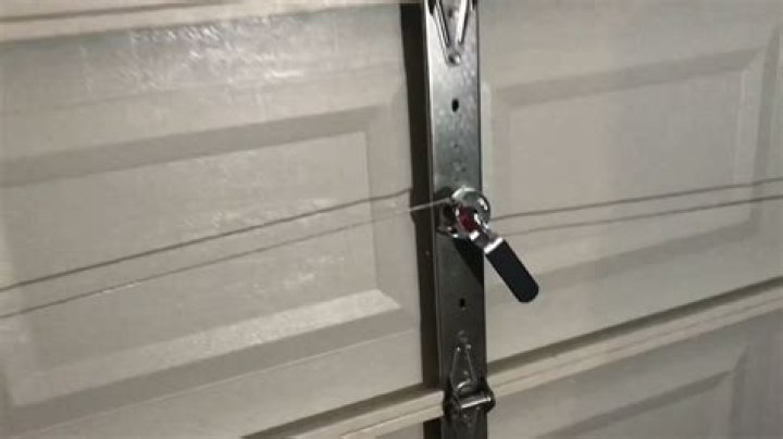 How do you unfreeze a garage door lock?