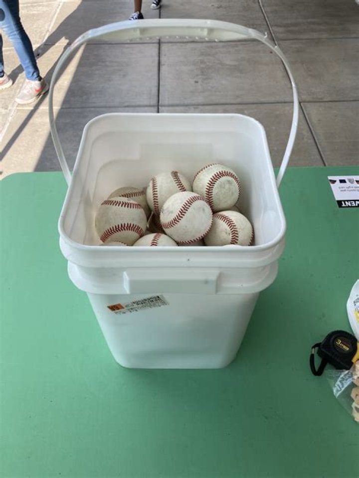 How much does a bucket of baseballs weigh?