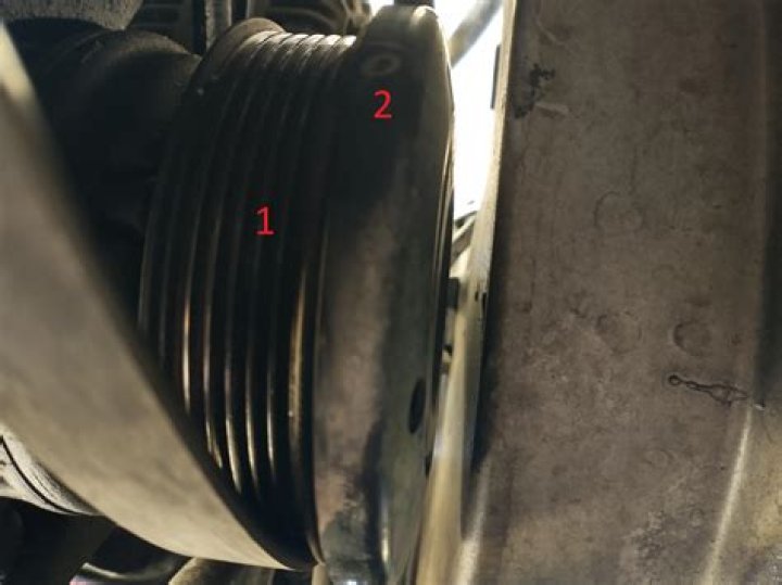 Is an AC compressor supposed to spin freely?