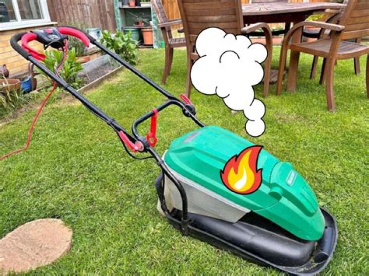What can cause a lawn mower to overheat?