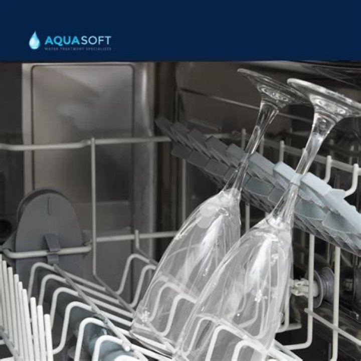 What causes etching on glassware in dishwasher?