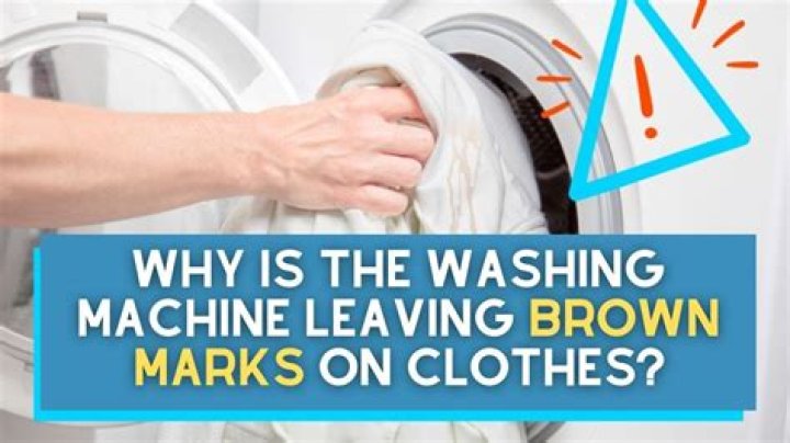 What causes white marks on dark clothes after washing?