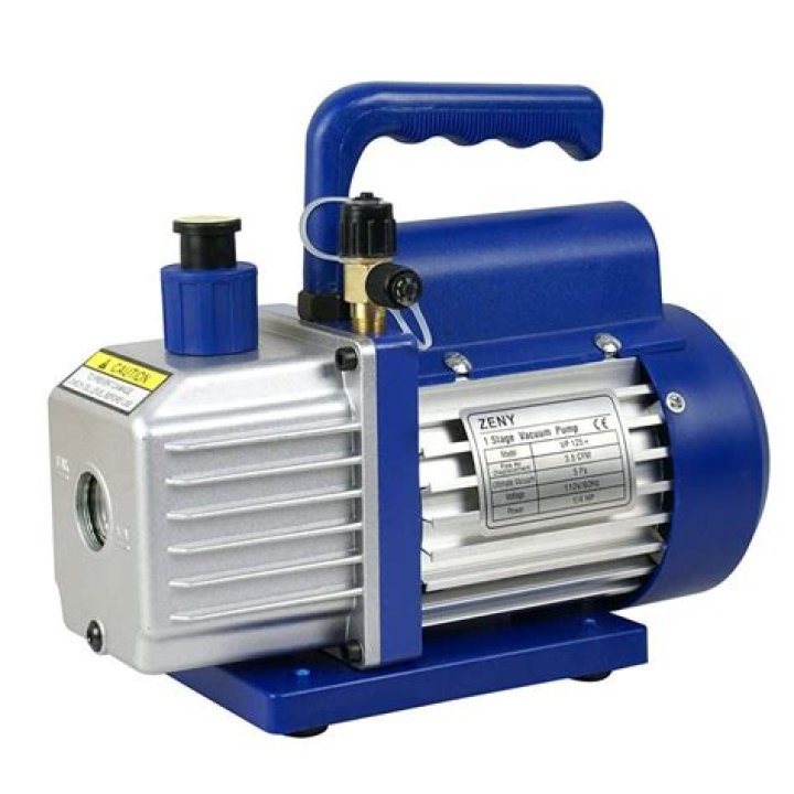 What is a vacuum pump used for in HVAC?