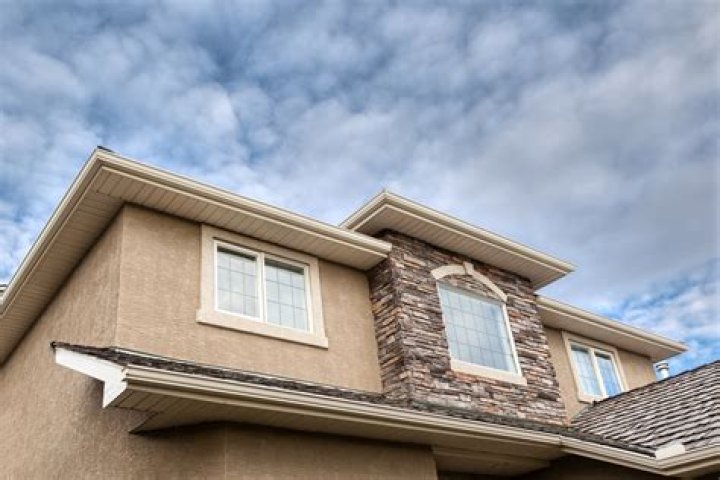 What is cheaper siding or stucco?