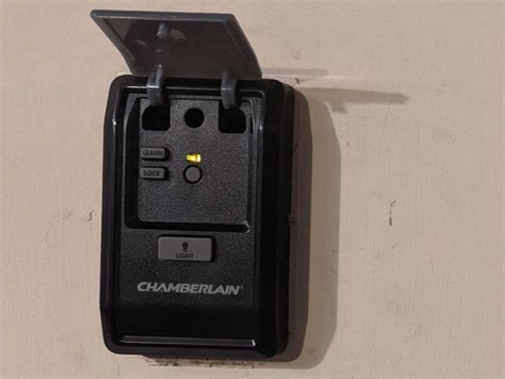 What is lock button on garage door opener?