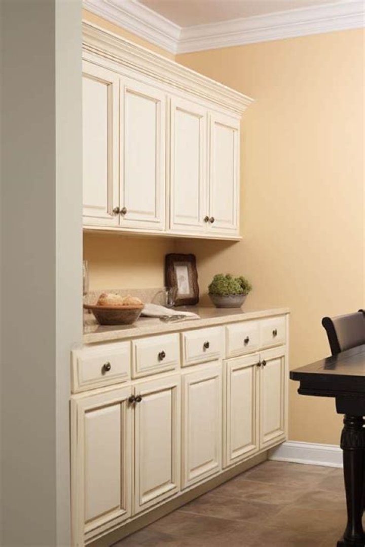What paint color goes with antique white cabinets?