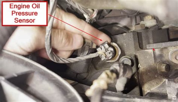 Where is the oil pressure sensor located on a 2014 Jeep Grand Cherokee?