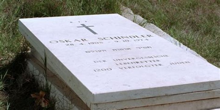 Who placed the rose on Schindler’s grave?